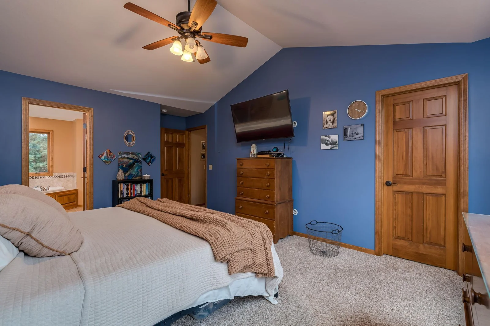 The primary bedroom with large walk-in closet & private bathroom.