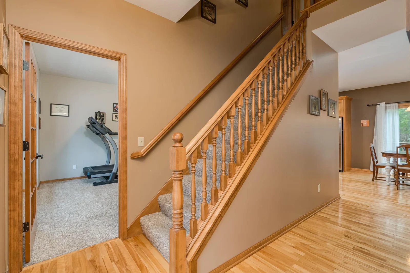 The wood railings really opens up the space and the staircase.
