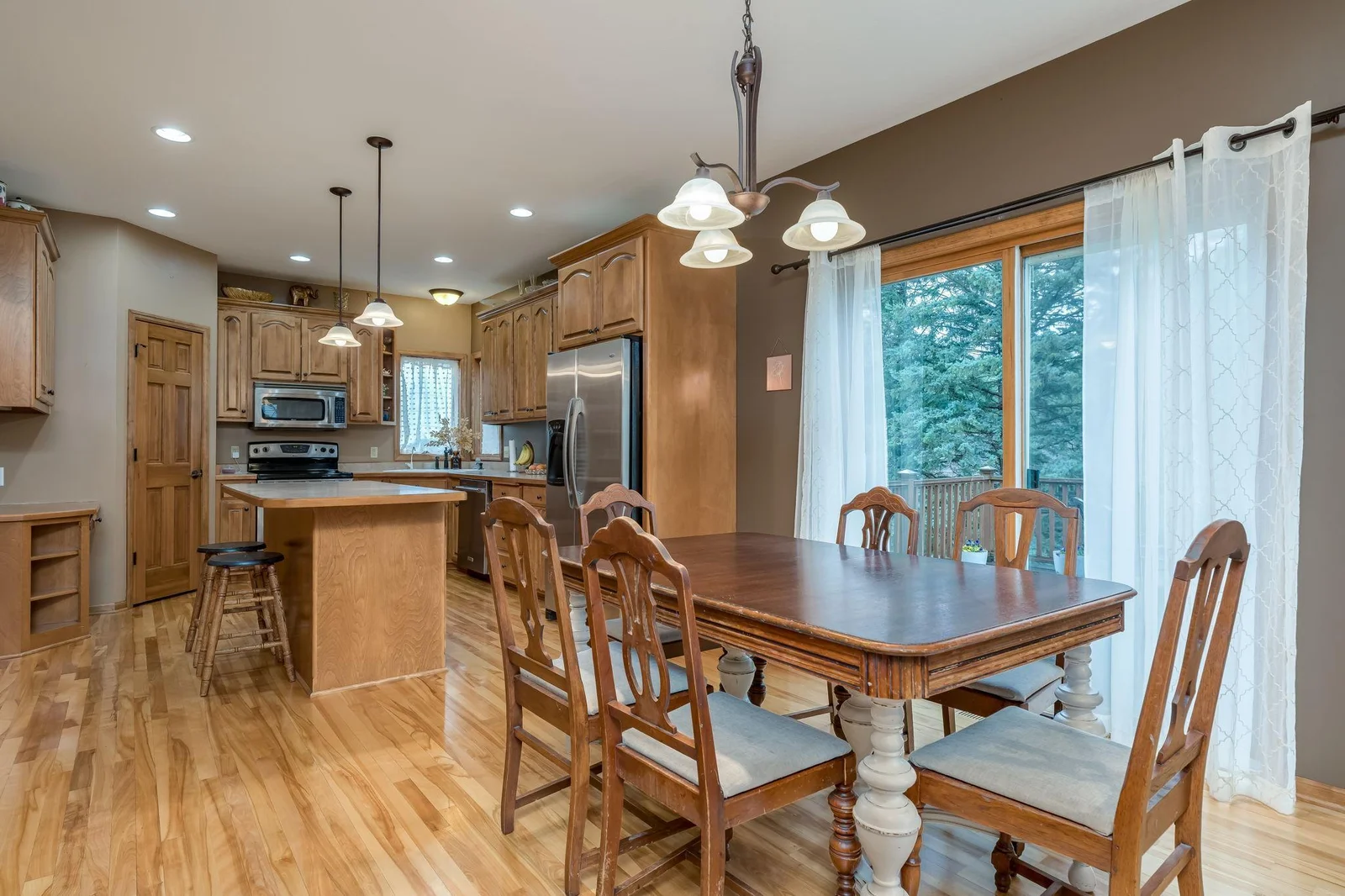 Kitchen and dining room both have real wood floors.