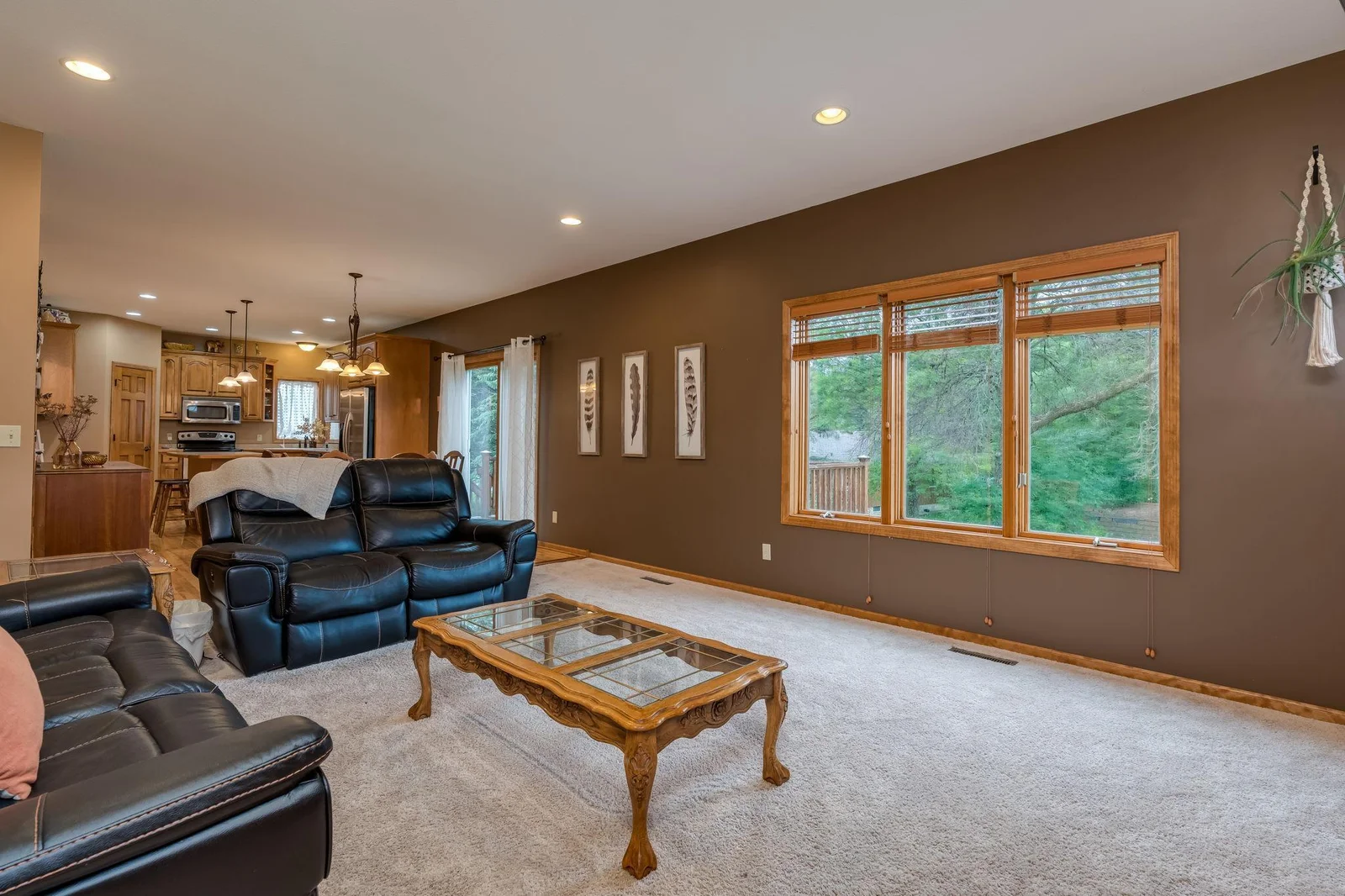 Main floor living room with nice views of the backyard.