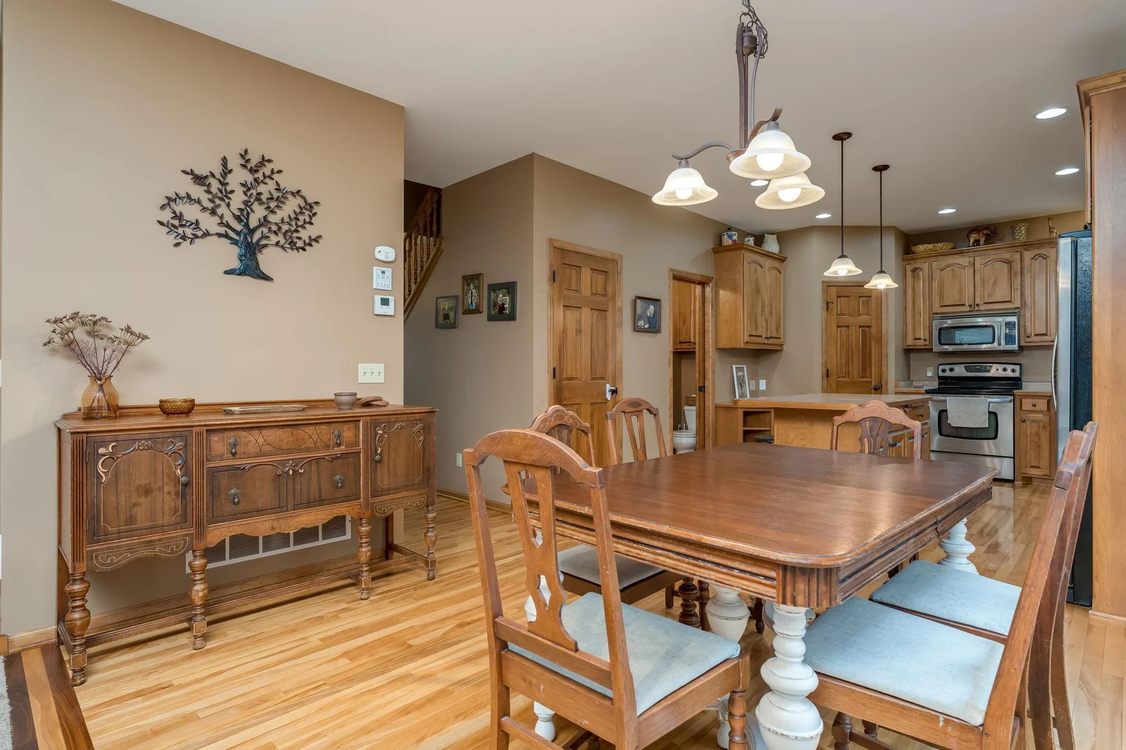 Dining room with real wood floors (You'll love the character of the wood inlays) and patio doors that bring you to the deck o'looking the backyard.