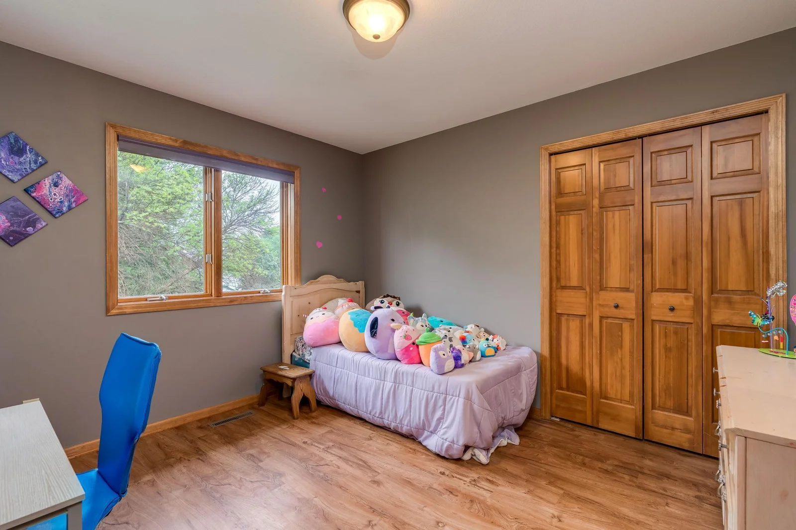 One of the 4 upstairs bedroom features LVP flooring.