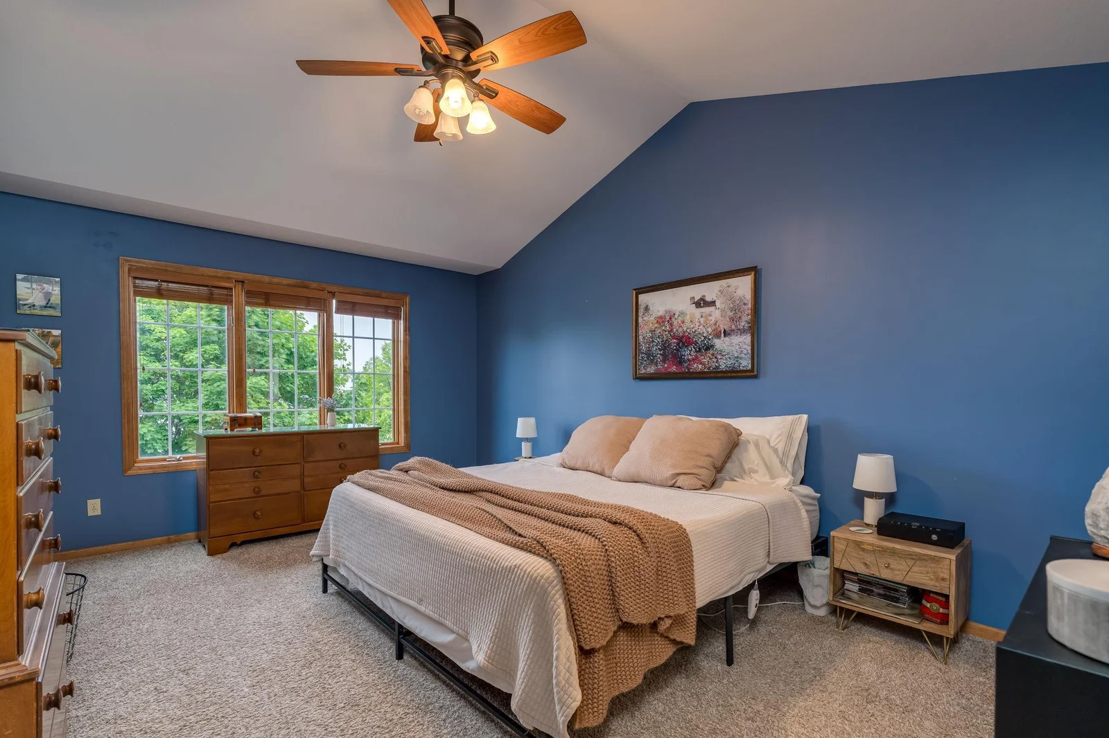 Large primary bedroom with vaulted ceilings, large walk-in closet and ensuite bathroom.