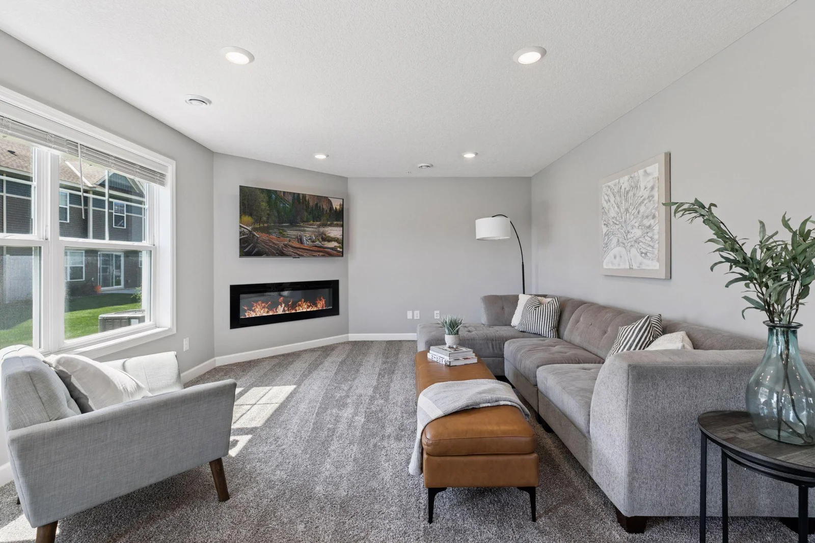 Living room complete with an electric fireplace