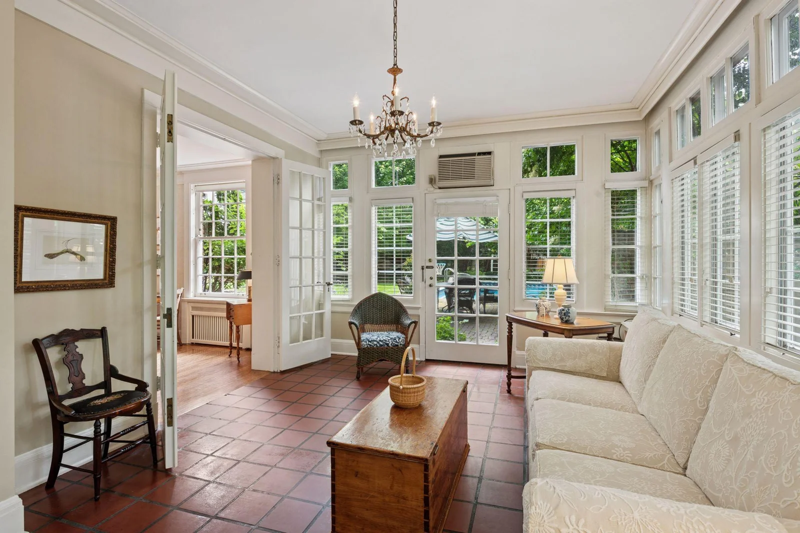 Classic French doors offer a lovely transition from the Living Room.