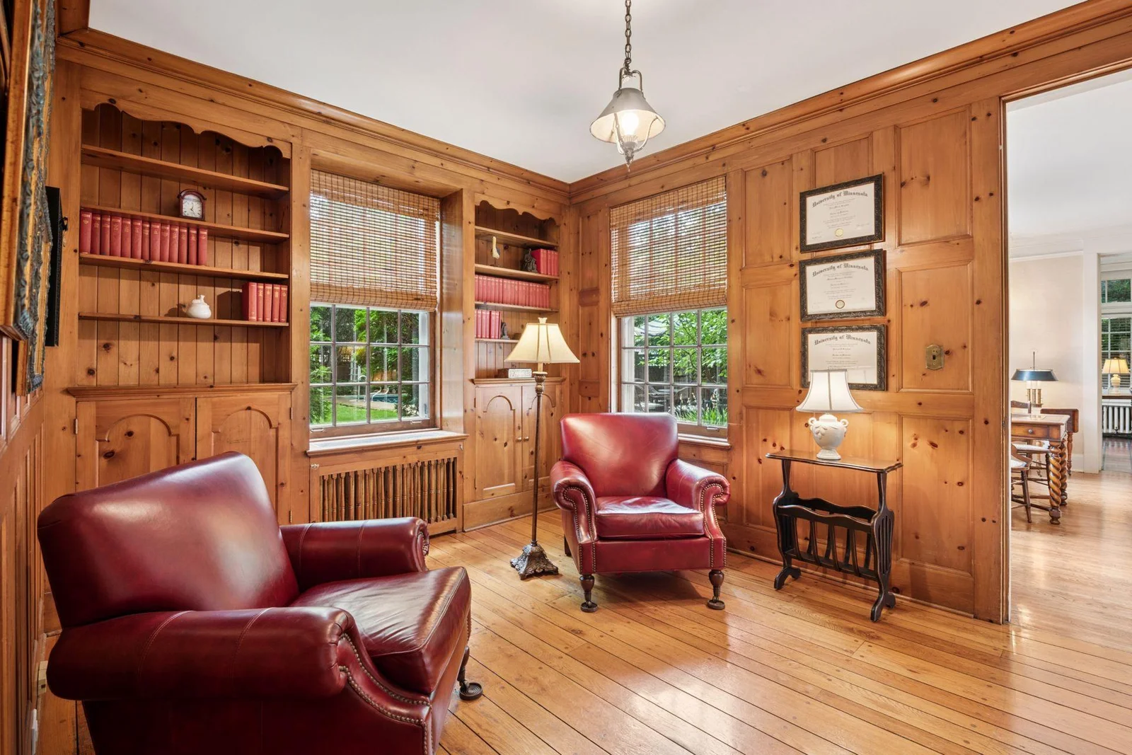 Main floor library with knotty pine walls.