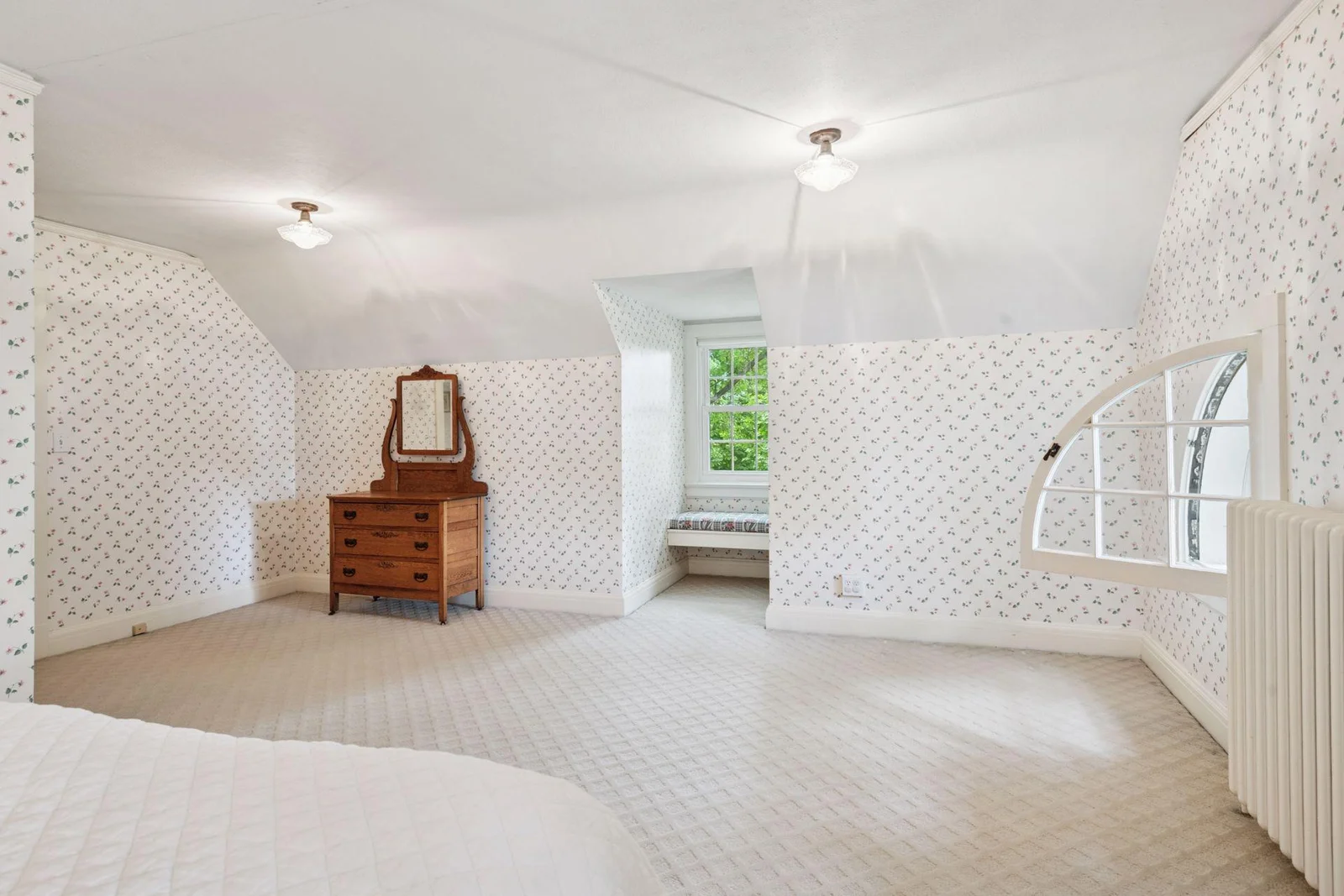 Don't miss the sweet window seat and note the coved ceiling.
