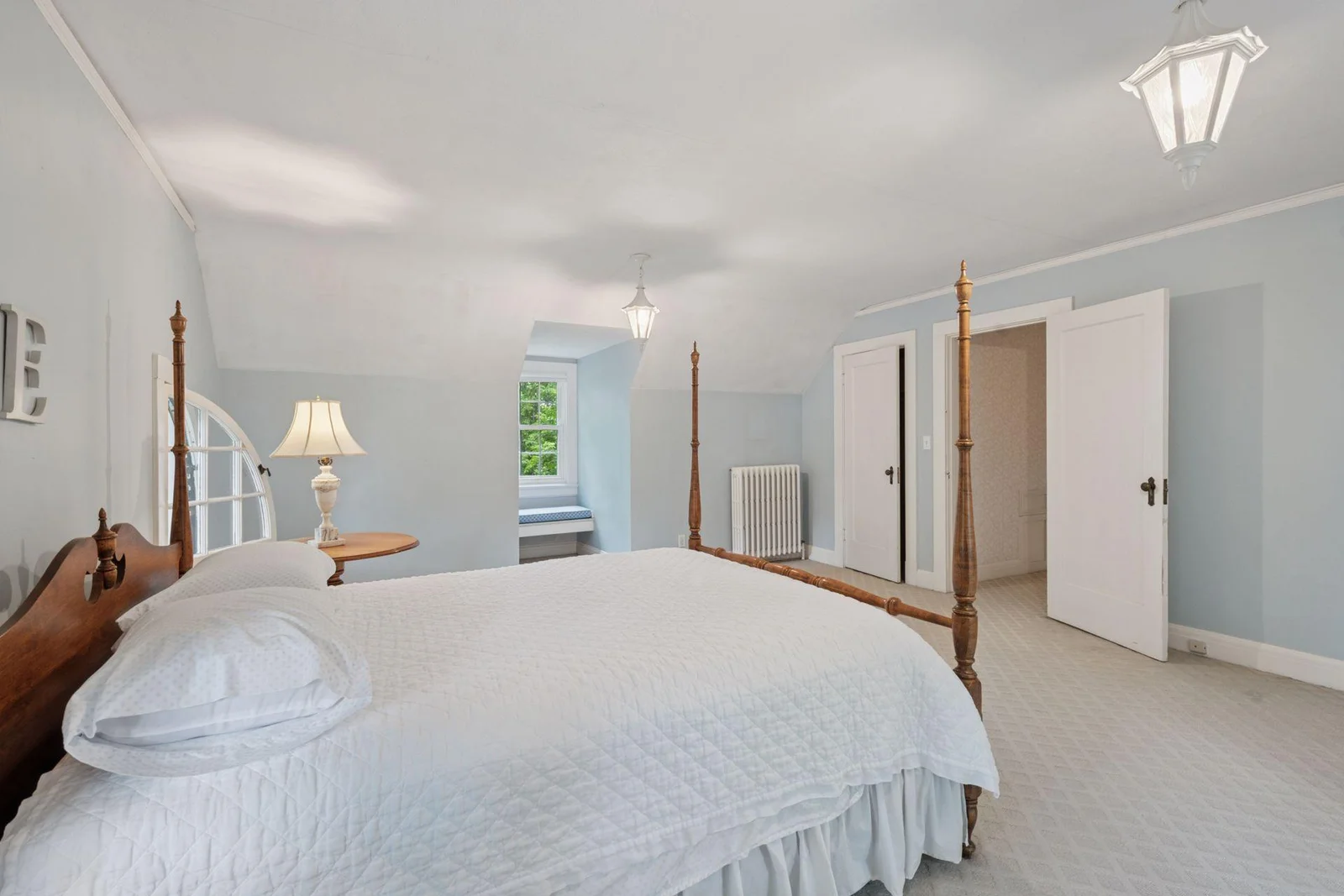 Another sweet window seat. Matching light fixtures and two closets.
