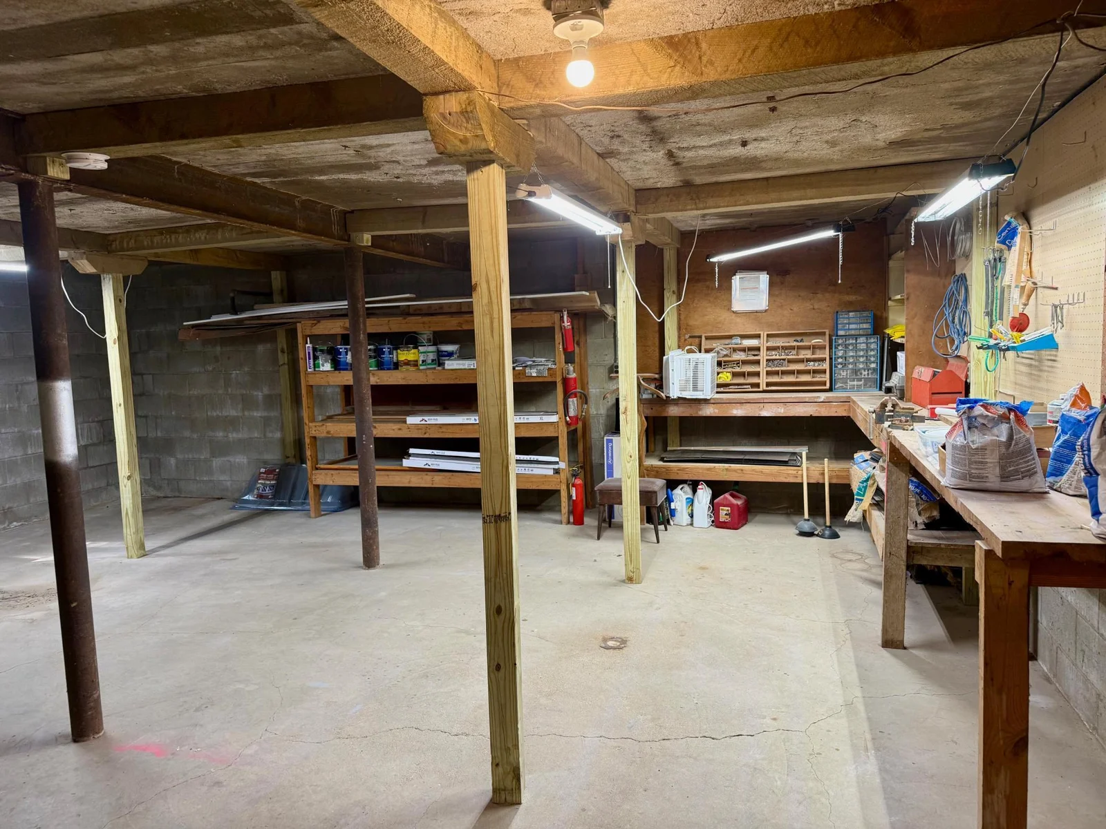 31-Workshop and storage utility room under garage in basement.jpg