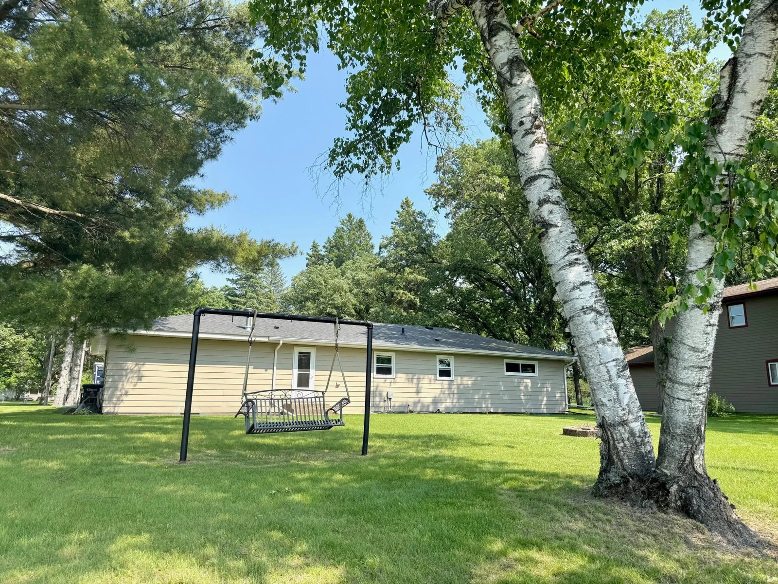 4-Rear of home showing mature trees for shade.jpg