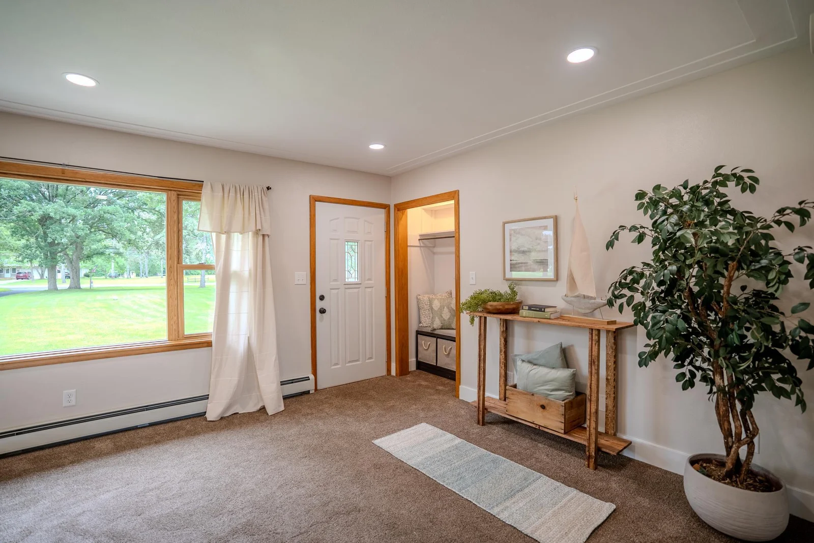 Living room view 2 showing front entrance.jpg