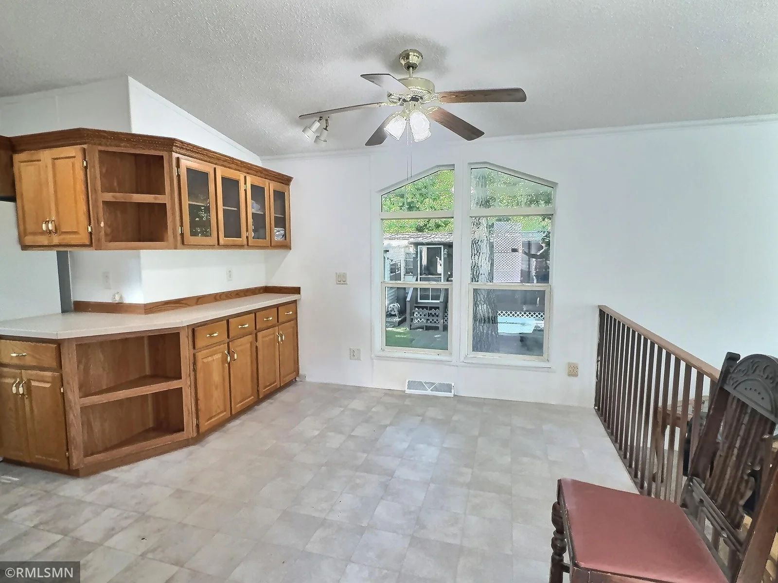 . Step into a spacious 3-bedroom, 2-bath home featuring vaulted ceilings, an open-concept kitchen and dining area.