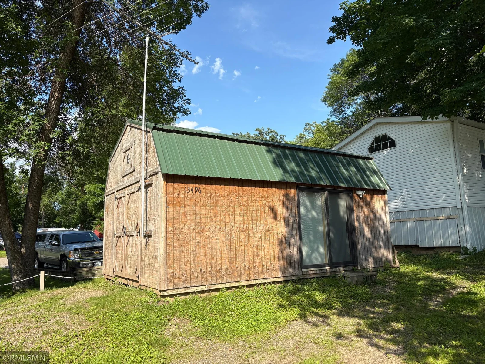 Storage shed/workshop has power ran to it and is located behind the home for your hobbies or extra storage needs.