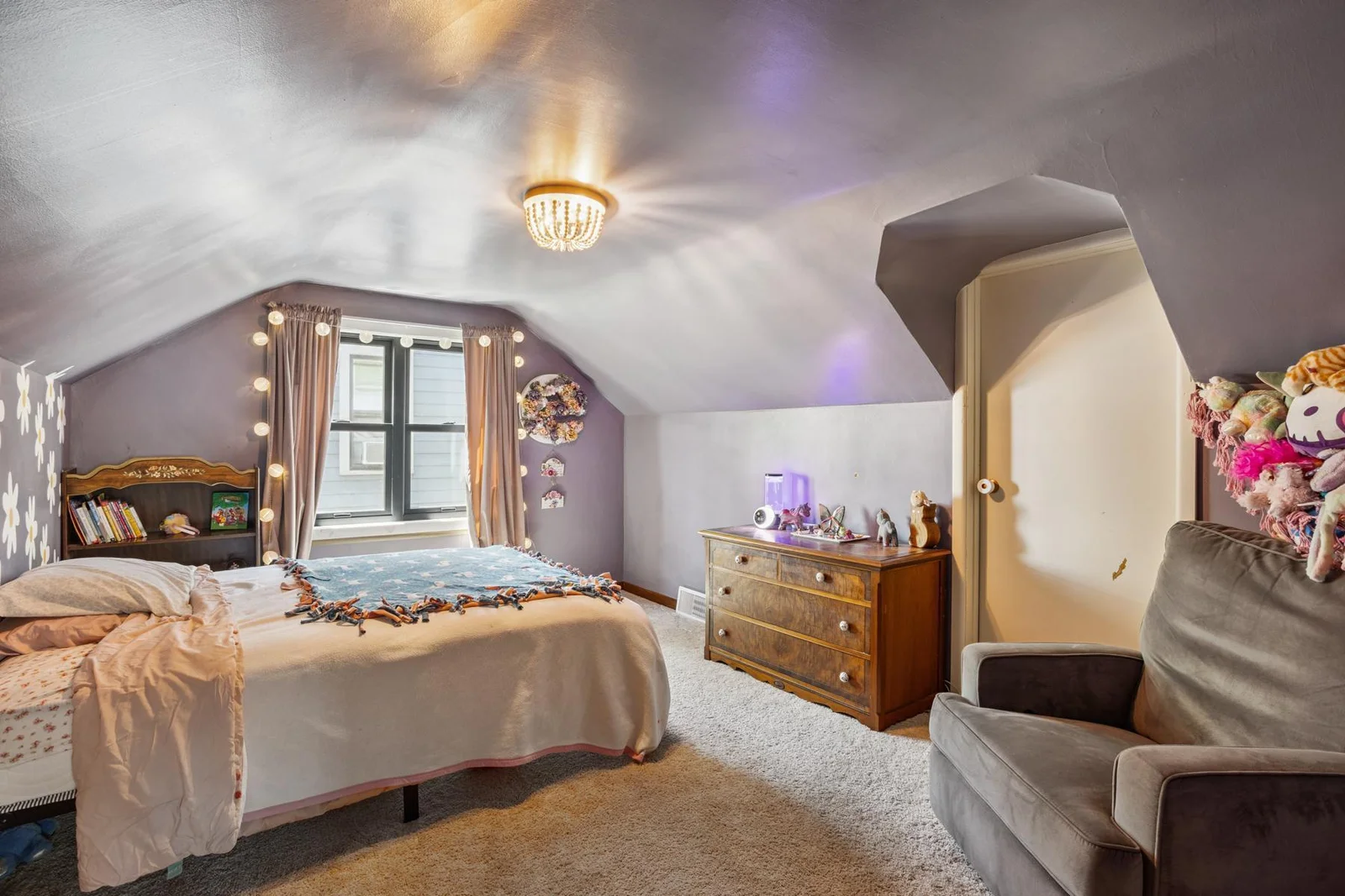Upper level bedroom with the attic access