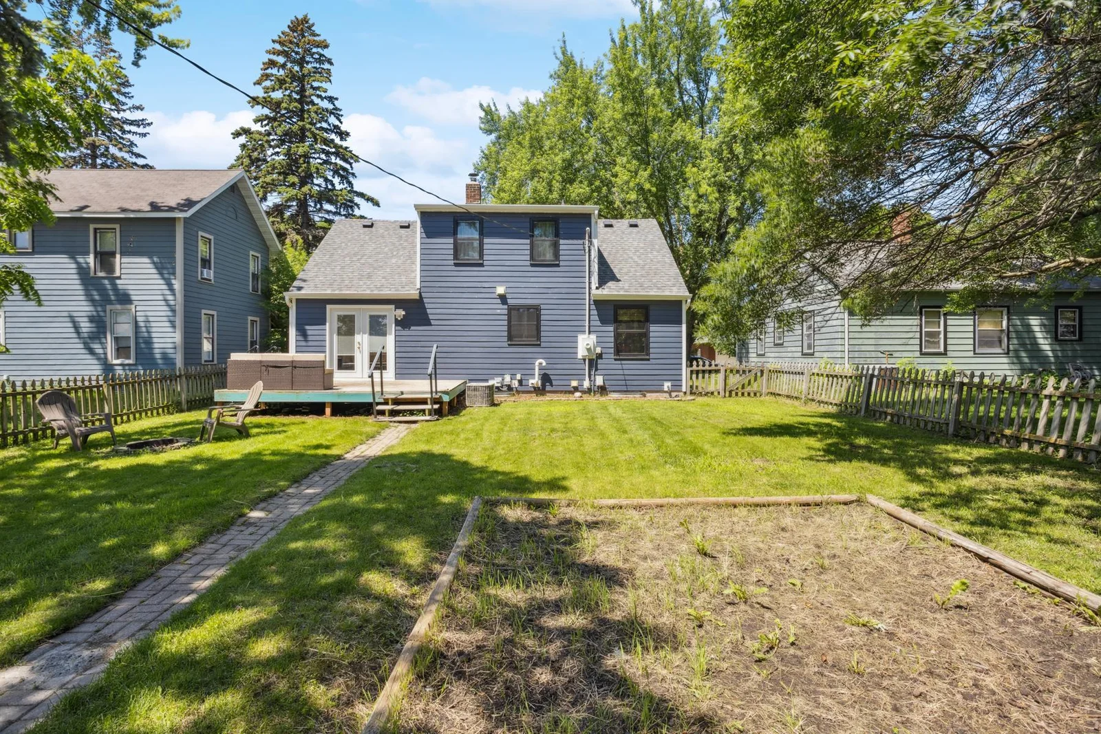 Back of the house with a garden