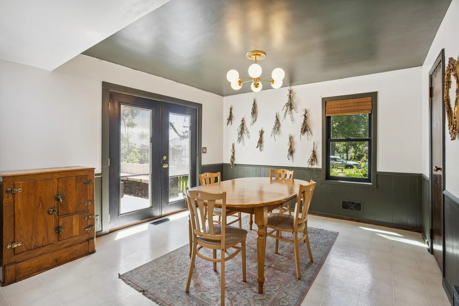 Dining room with patio door that leads out to the deck and backyard