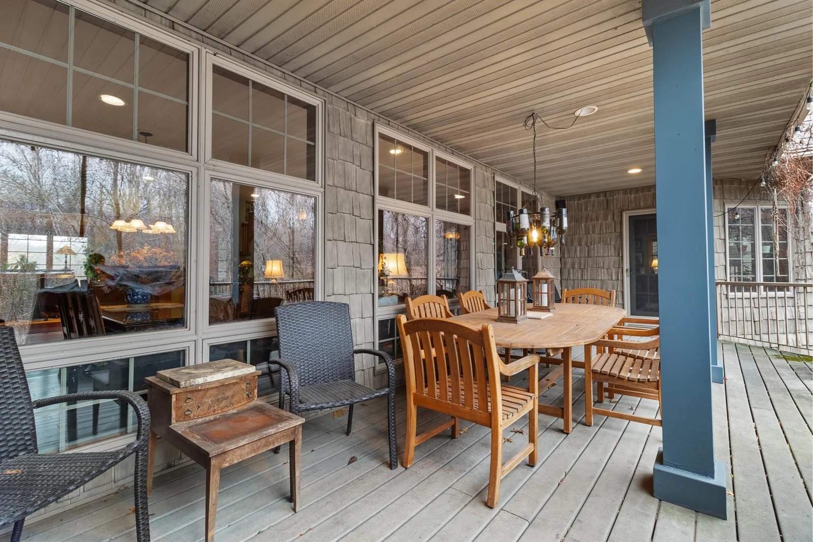 Full length covered patio with Trex-like flooring and view to backyard, and stairs to lower patio, spa and rod iron fenced area. Speakers connected to whole house audio.