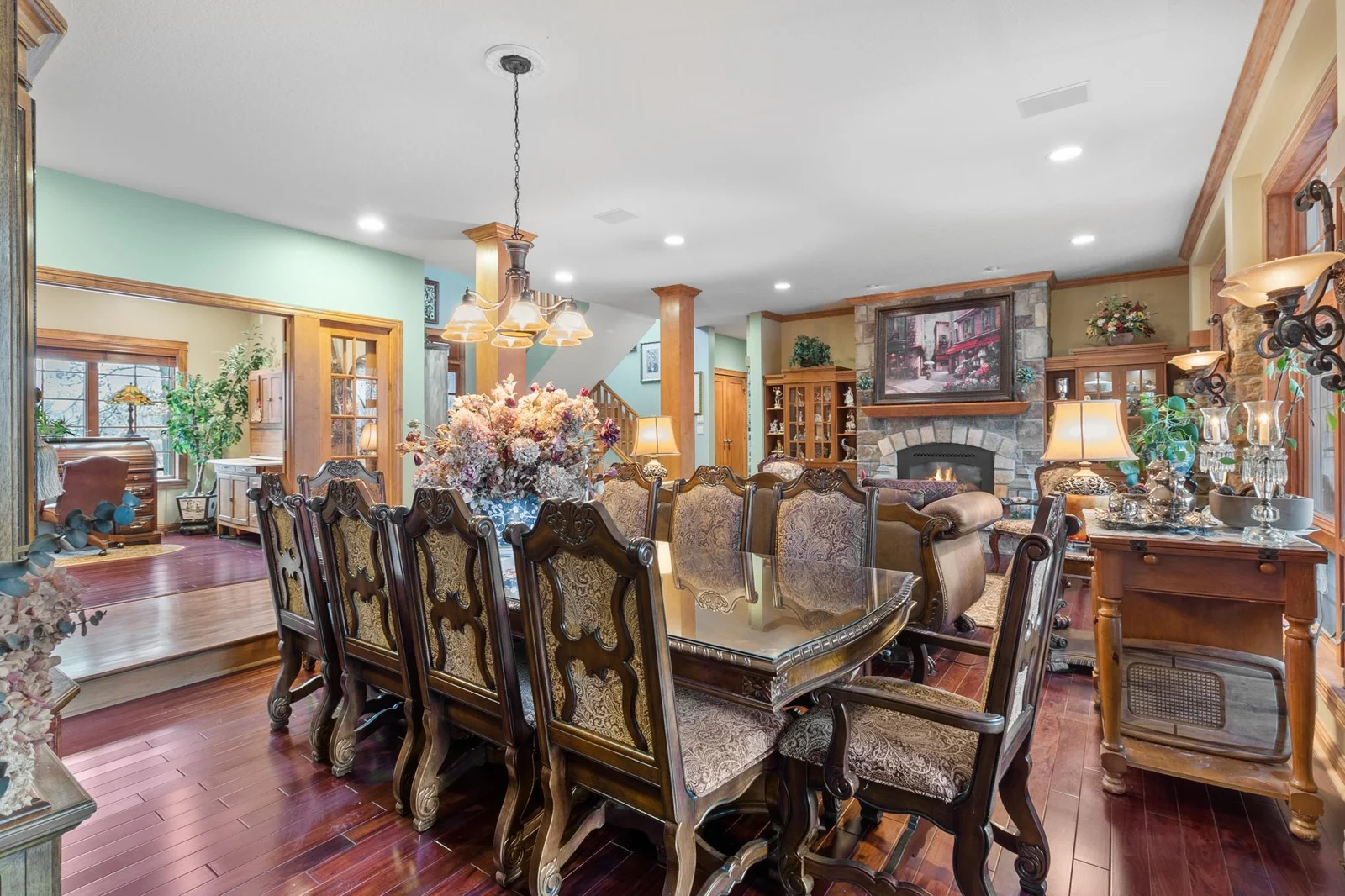 Formal Dining Room sunken from main hallway. Office, entry and living room are shown in background. Ceiling speakers part of whole house audio.