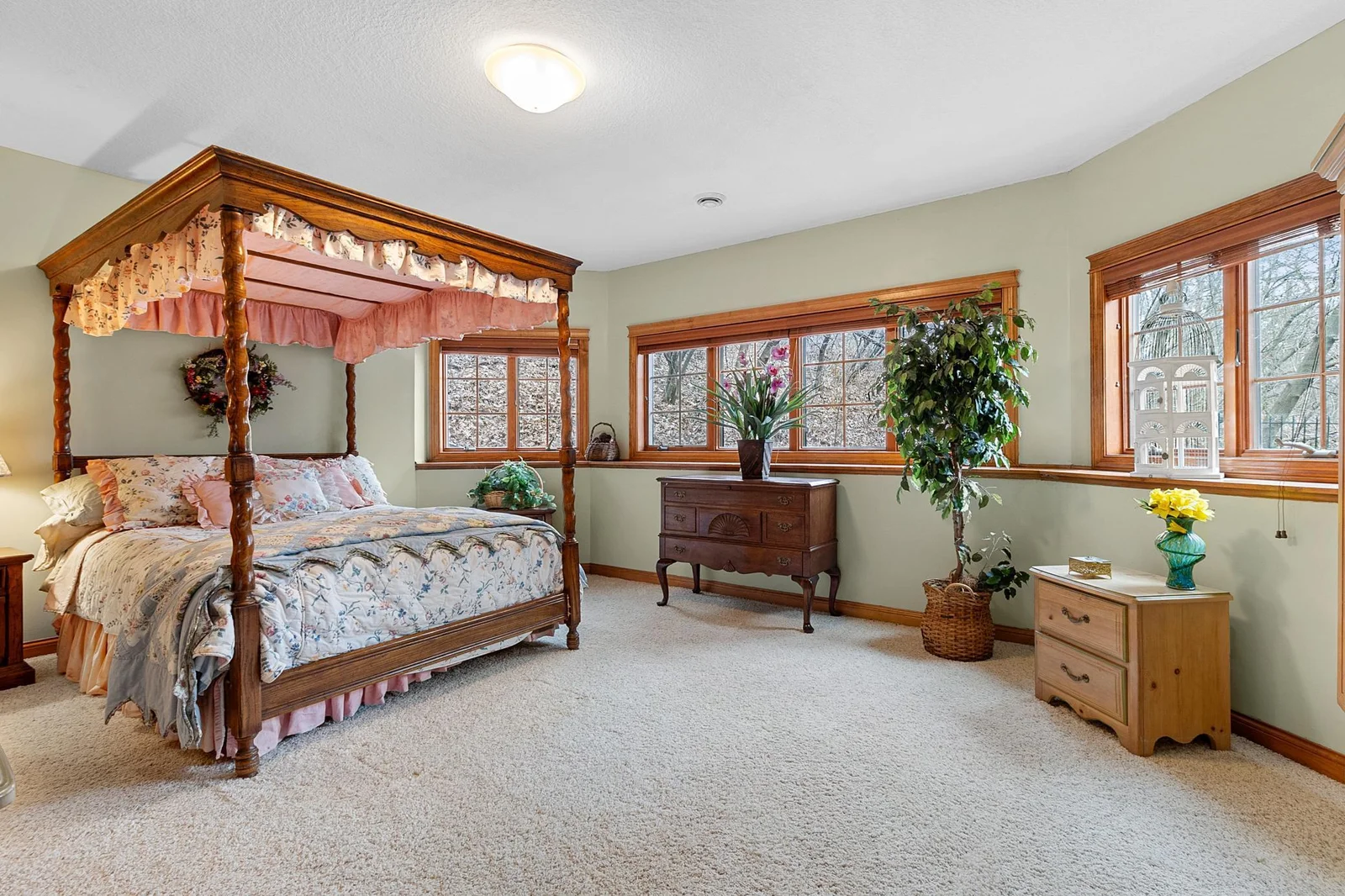Lower-level second bedroom with full bath and walk-in closet. View toward woods, hot tub and fenced area. Wired LAN available.