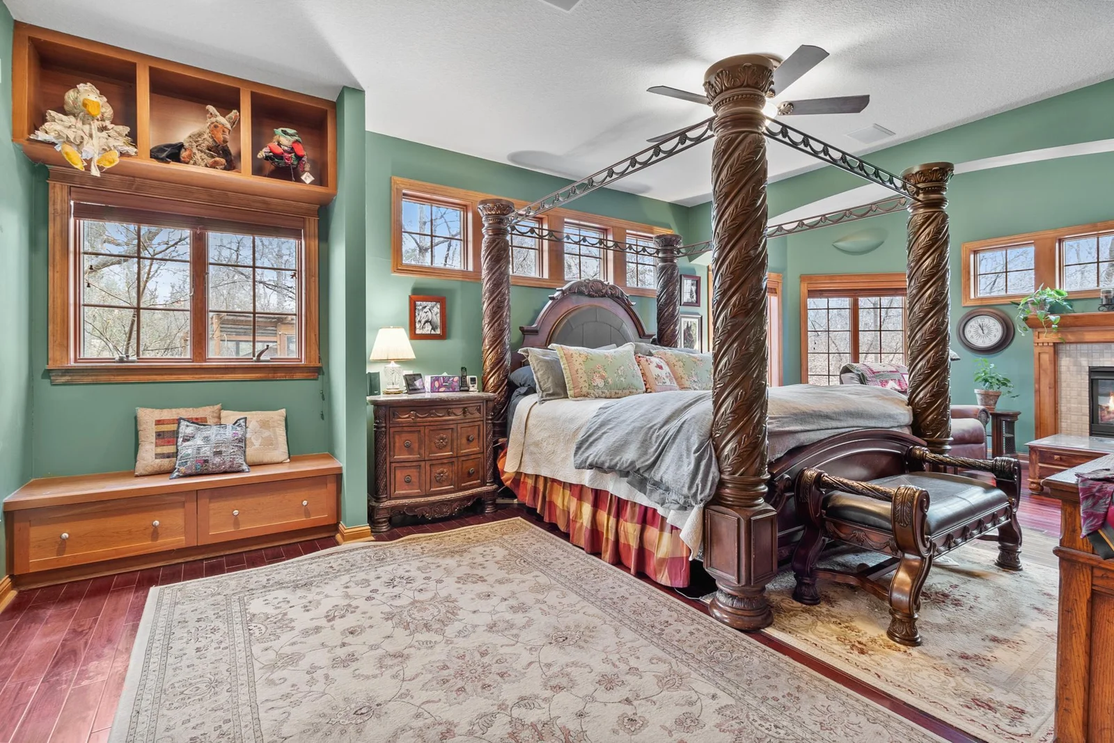 Primary bedroom suite. High ceilings. Mahogany hardwood floors. Showing open to sitting area with fireplace and door to full length deck. Ceiling speakers connected to whole house audio.