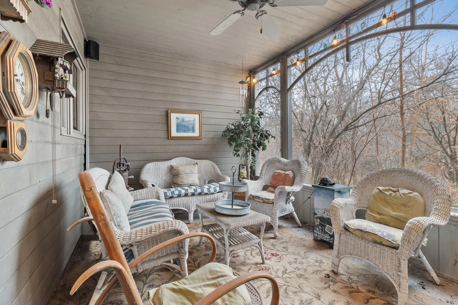 Screened in porch with entry door to main hallway and screen door to garage and driveway area. Speakers part of whole house audio.
