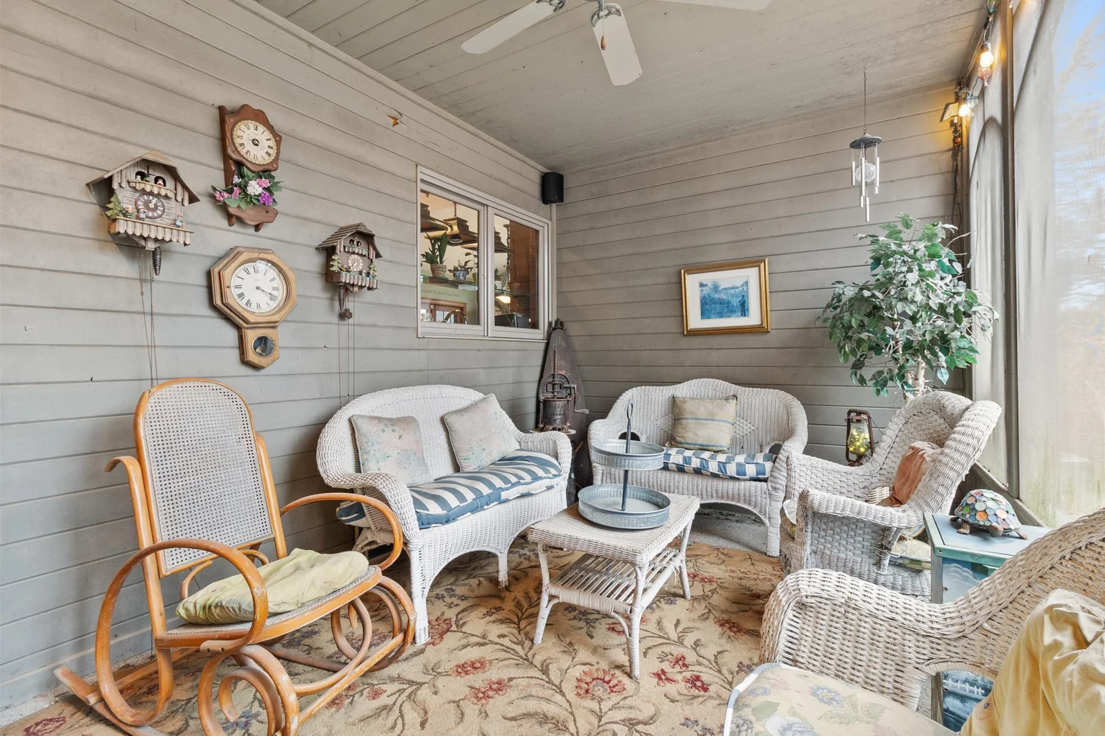Screened in porch showing pass through to kitchen.