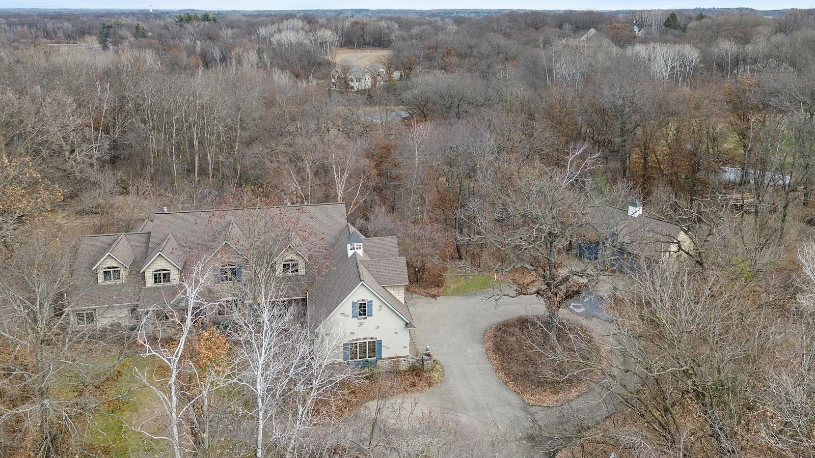 House, driveway circle giving access to both the attached and detached garages.