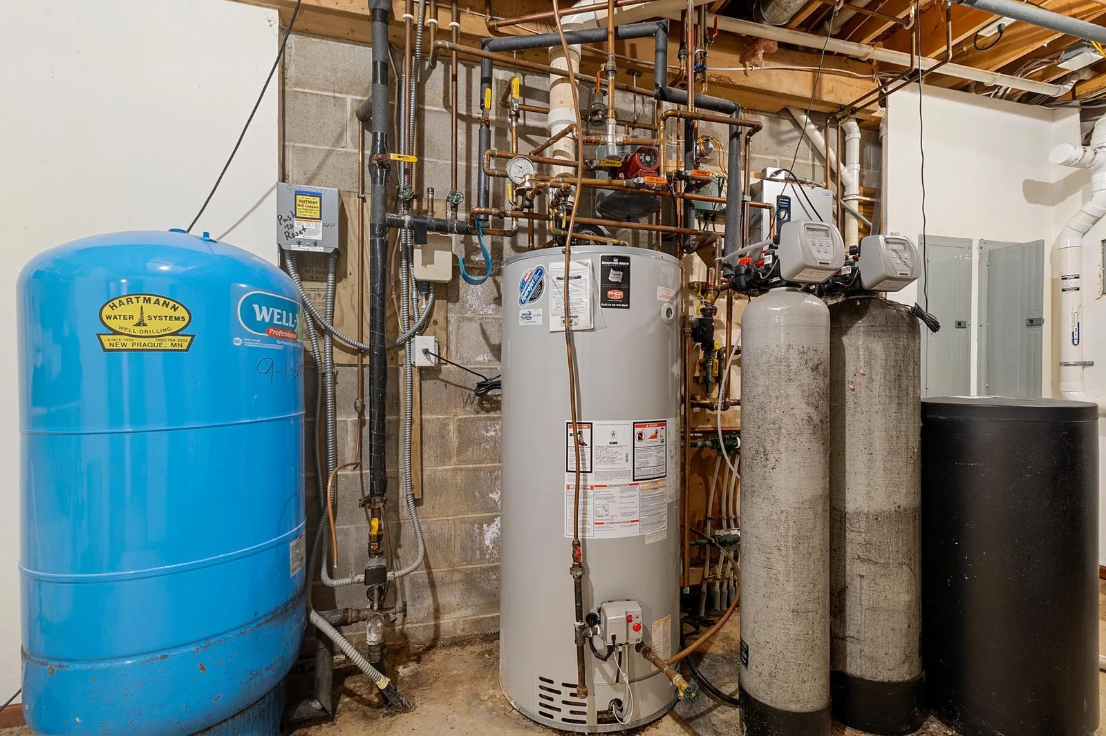 Main and lower lever level mechanical room. High-flow (20+ gpm) well delivers plenty of pressure and flow. Recent Lenox HVAC. Boiler for radiant heat for the attached garage and supplemental heat for lower level.