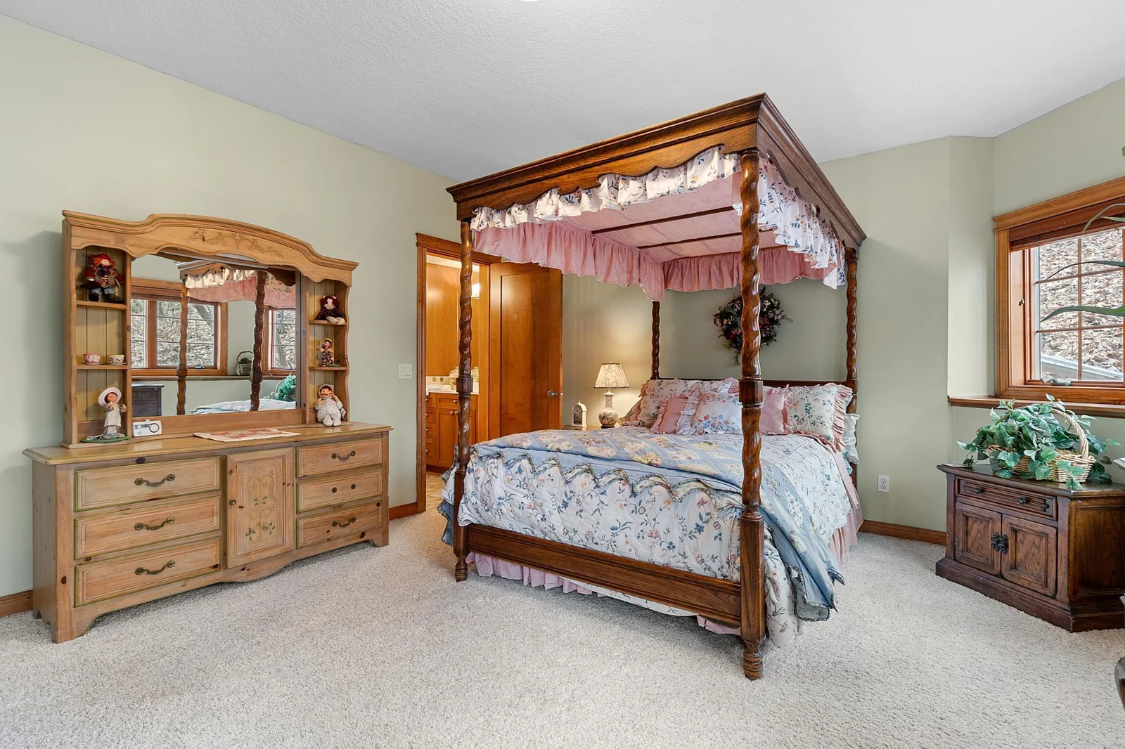 Lower-level second bedroom with full bath and walk-in closet. View toward woods, hot tub and fenced area. Wired LAN available.