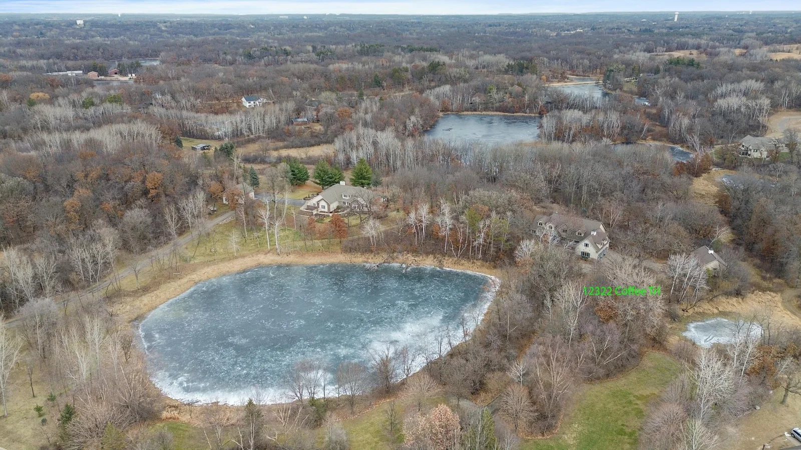 View looking north showing larger pond and house labeled on right side.