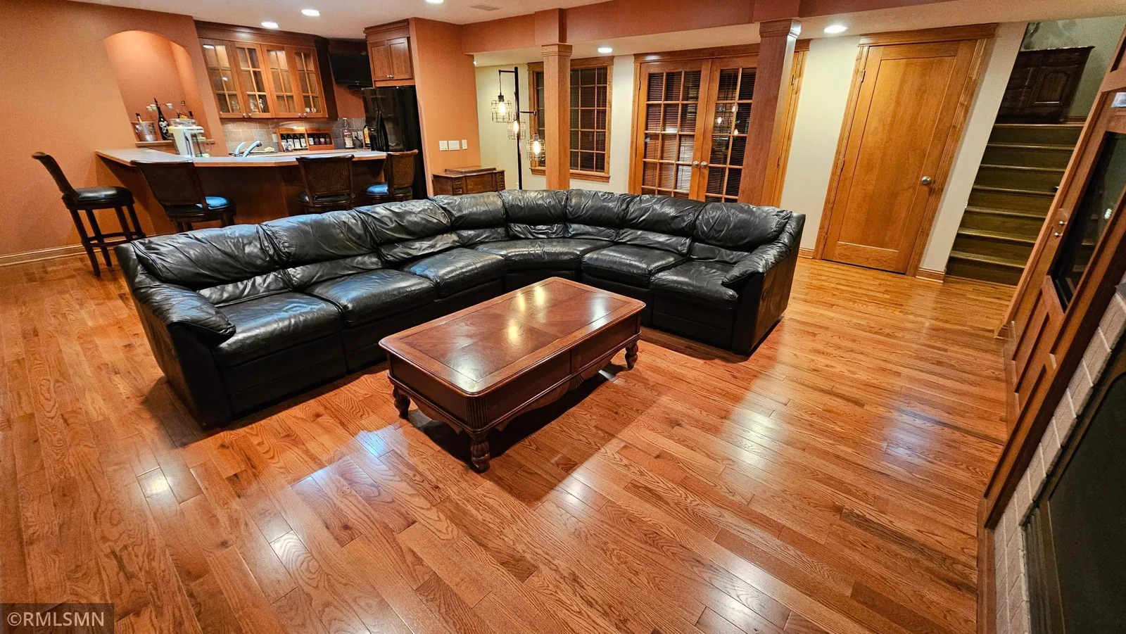 Lower-level recreation room with new solid oak hardwood floors