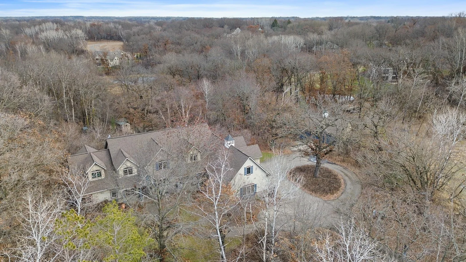Wider view showing house, lawn, woods with mature trees. Very private.