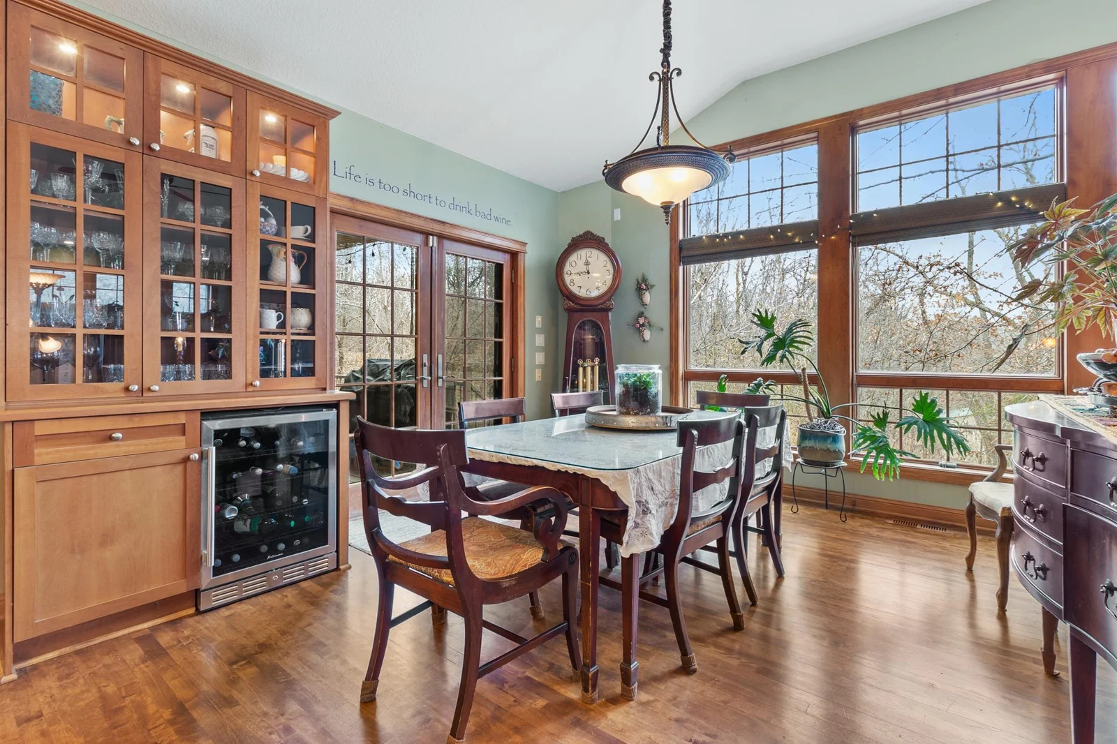 Eating area open from kitchen. French doors to full length covered patio. Floor-to-ceiling windows overlook back yard, and your private horse paddock.