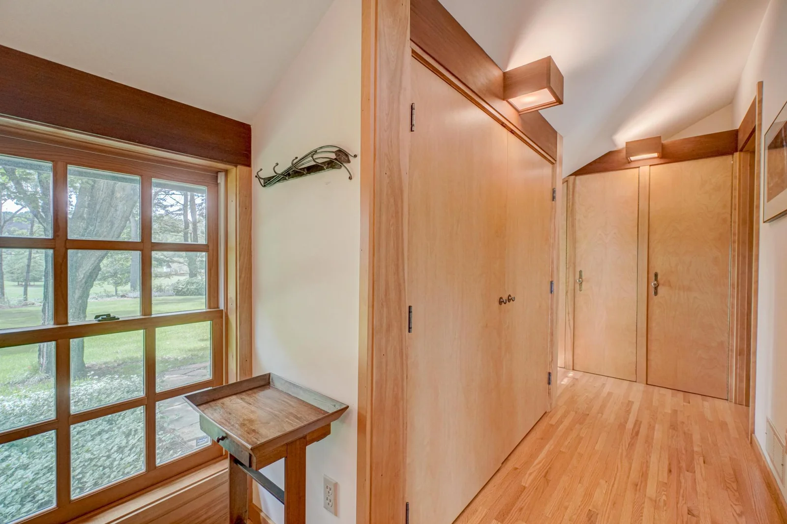 There is abundant closet space in this vestibule off the entryway.