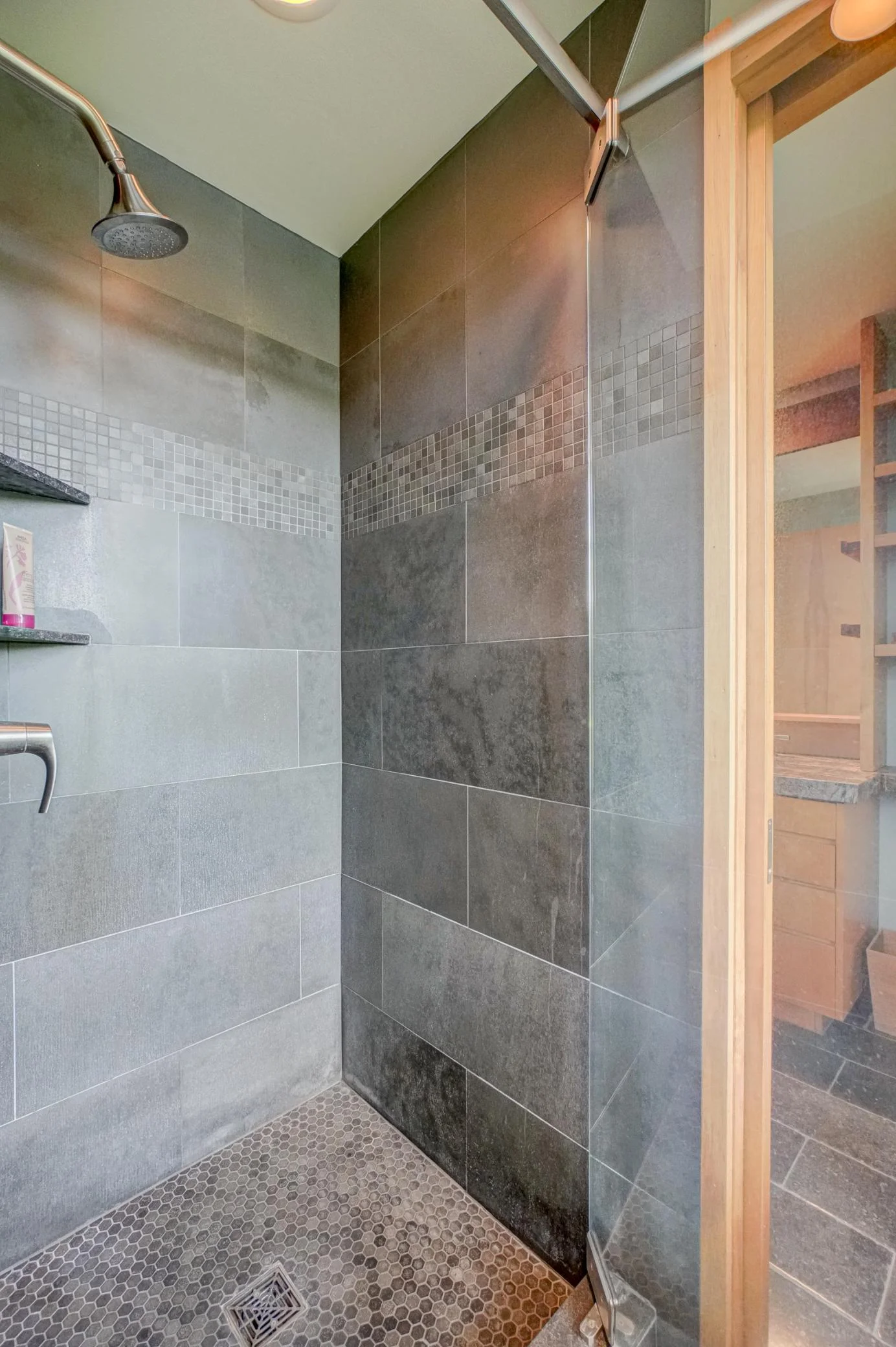 The honed-tile walk-in shower.