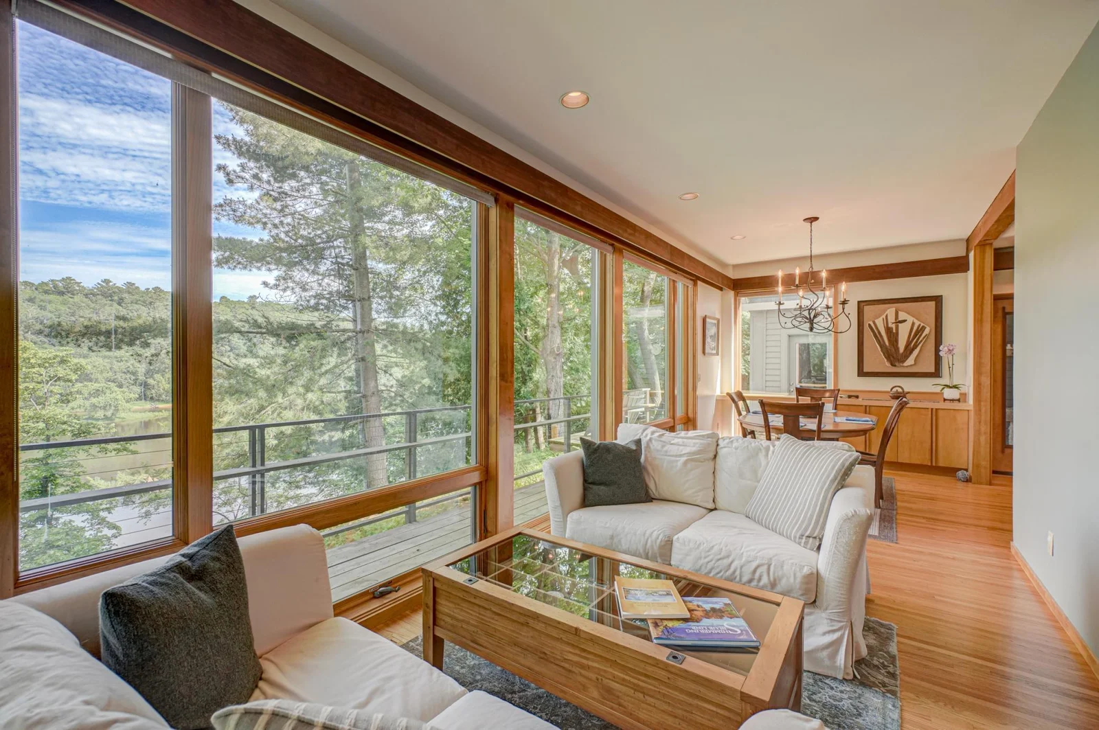 The walls of windows in this home integrate the outside views with interior spaces. The warmth of the cherry and maple woodwork is seen throughout the home.
