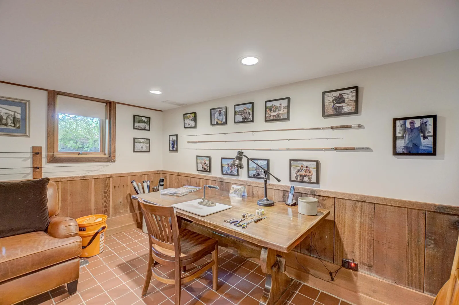 The broad board wainscoting adds warmth and visual interest to the room.