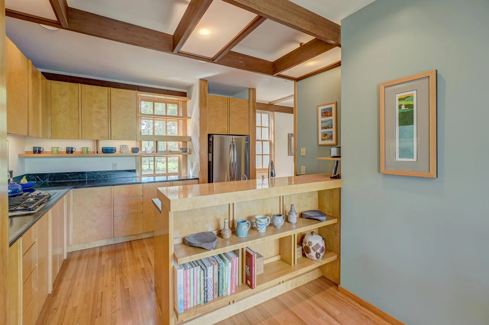 The 2012 kitchen remodel by Hagstrom Builder features custom maple cabinetry, soapstone countertops, and top of the line stainless appliances