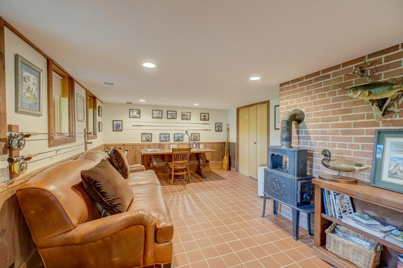 There is a large walk-in storage closet behind the custom maple doors.