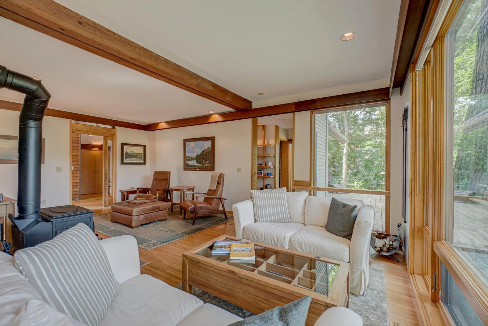 The soft-lit cherry soffits carry a congruity of design throughout the home.