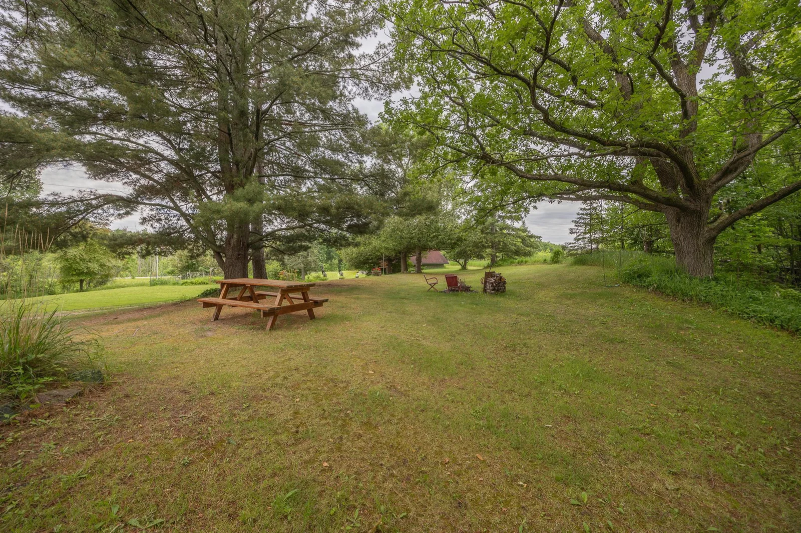 Park like setting with mature trees and lake views