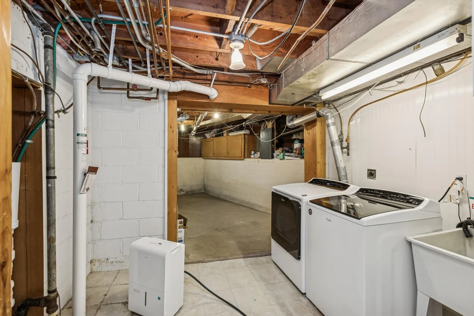Laundry Room in Lower Level with Excellent Storage