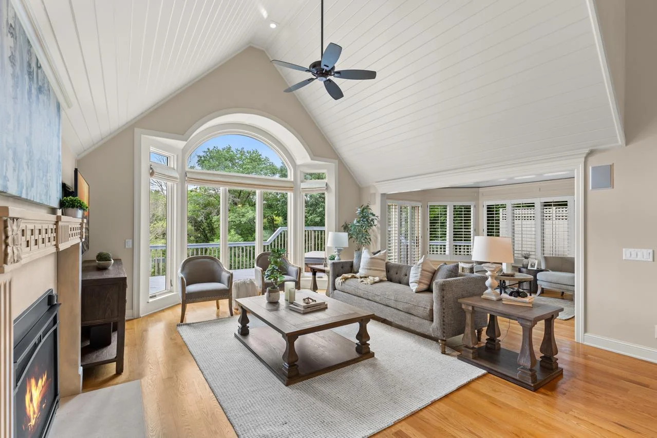 Gleaming hardwood floors and vaulted ceilings create a spacious and elegant atmosphere.