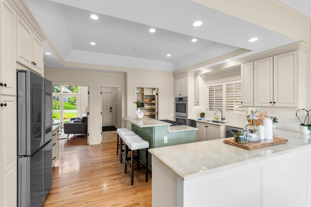 Marble countertops and a huge center island—great for prep and entertaining.