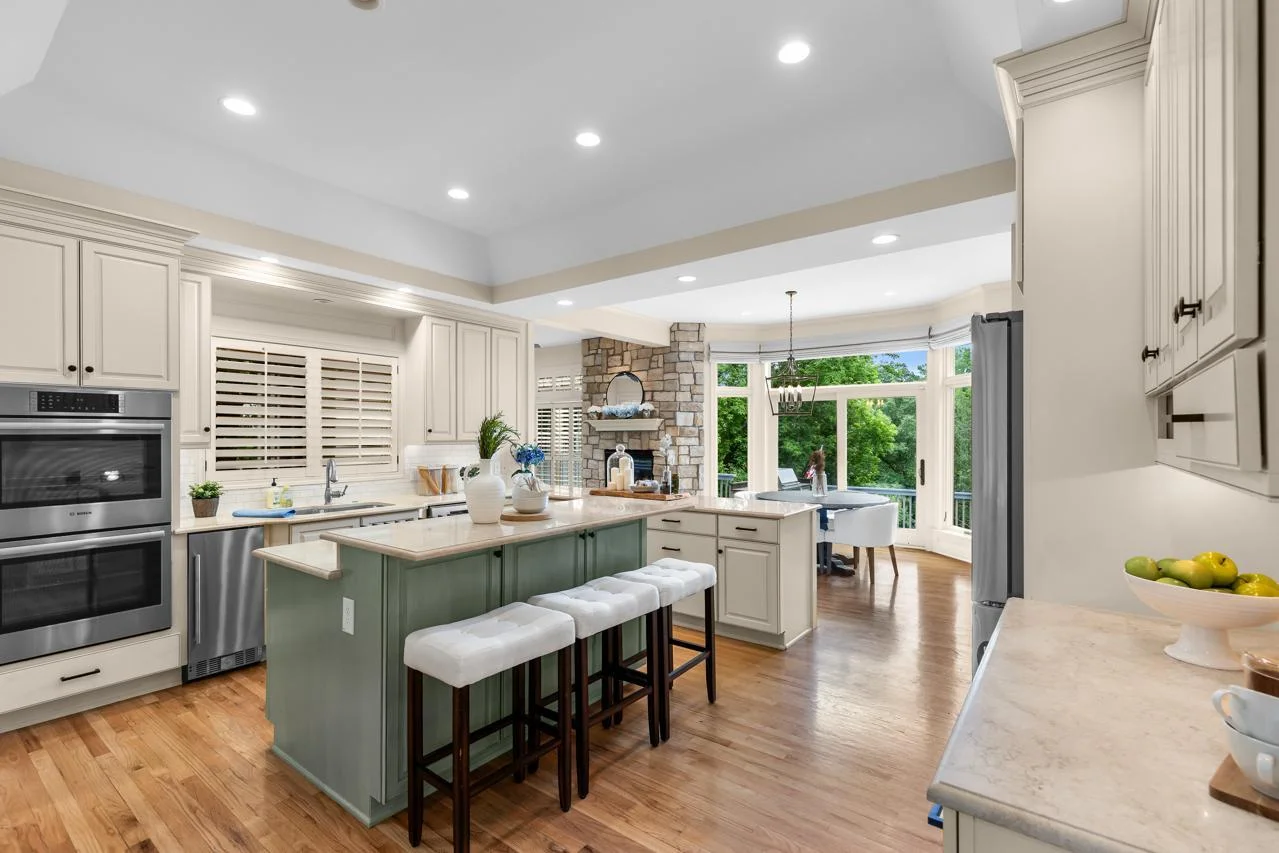 The kitchen flows seamlessly into the Great Room and surrounding living spaces, creating an open and inviting layout ideal for everyday living and entertaining.