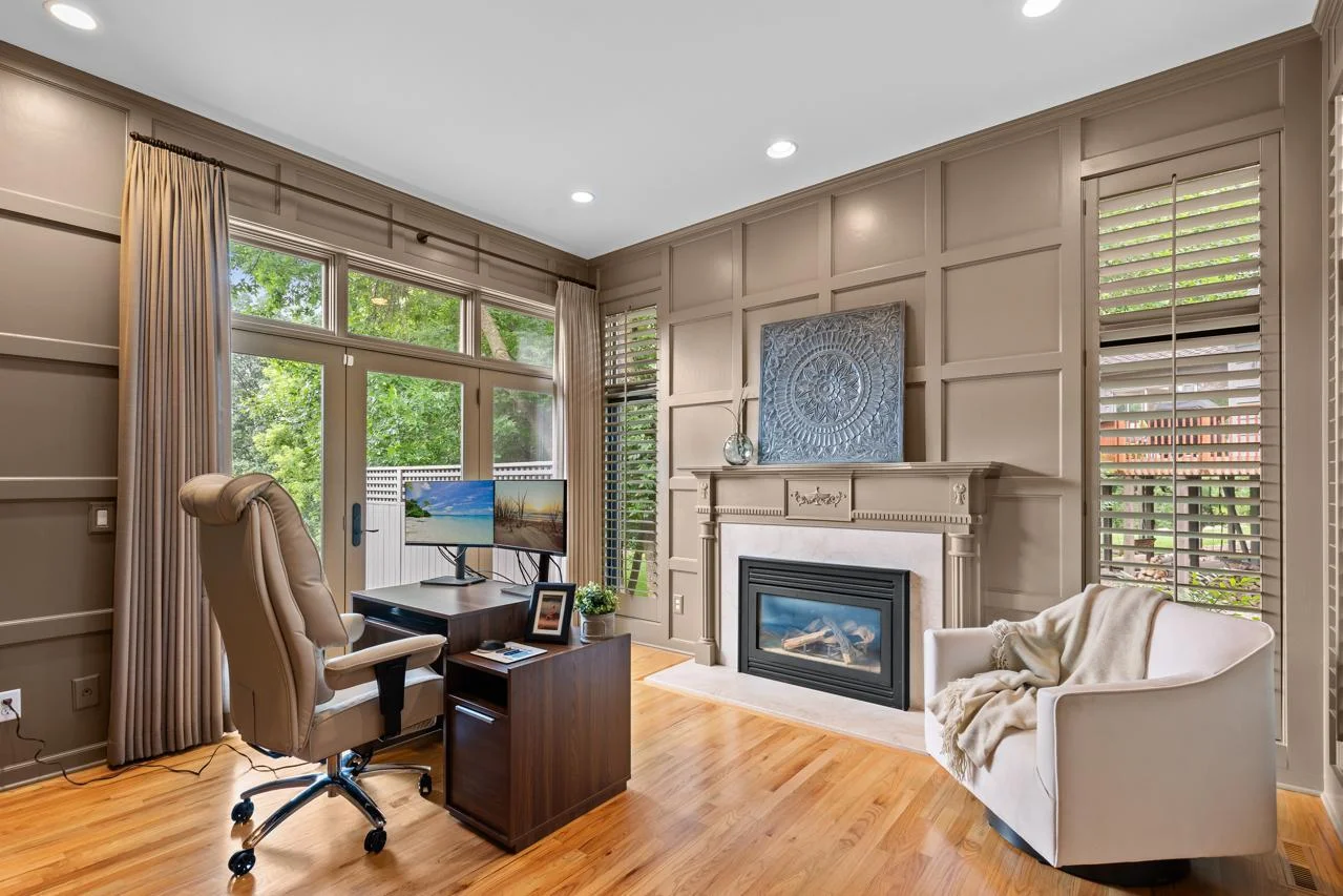 Large main floor office with built-ins and private access to the deck