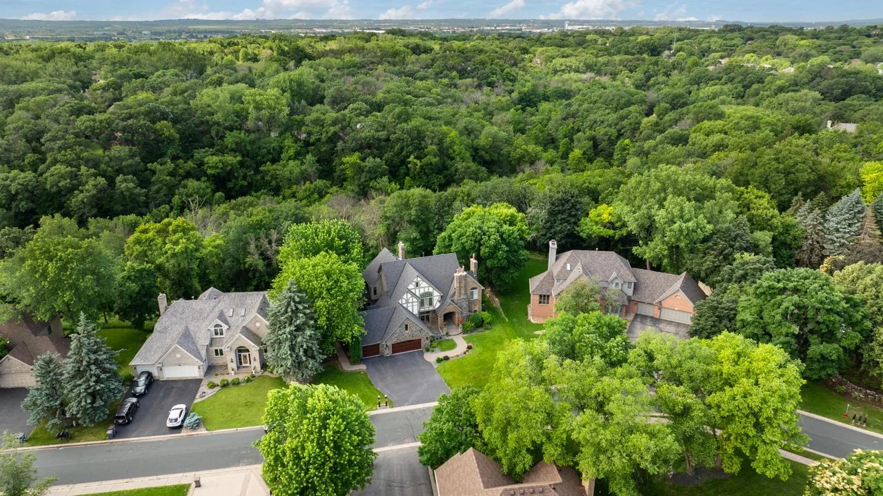 This home is beautifully surrounded by mature trees, offering a serene, private setting and lush green views from every window.