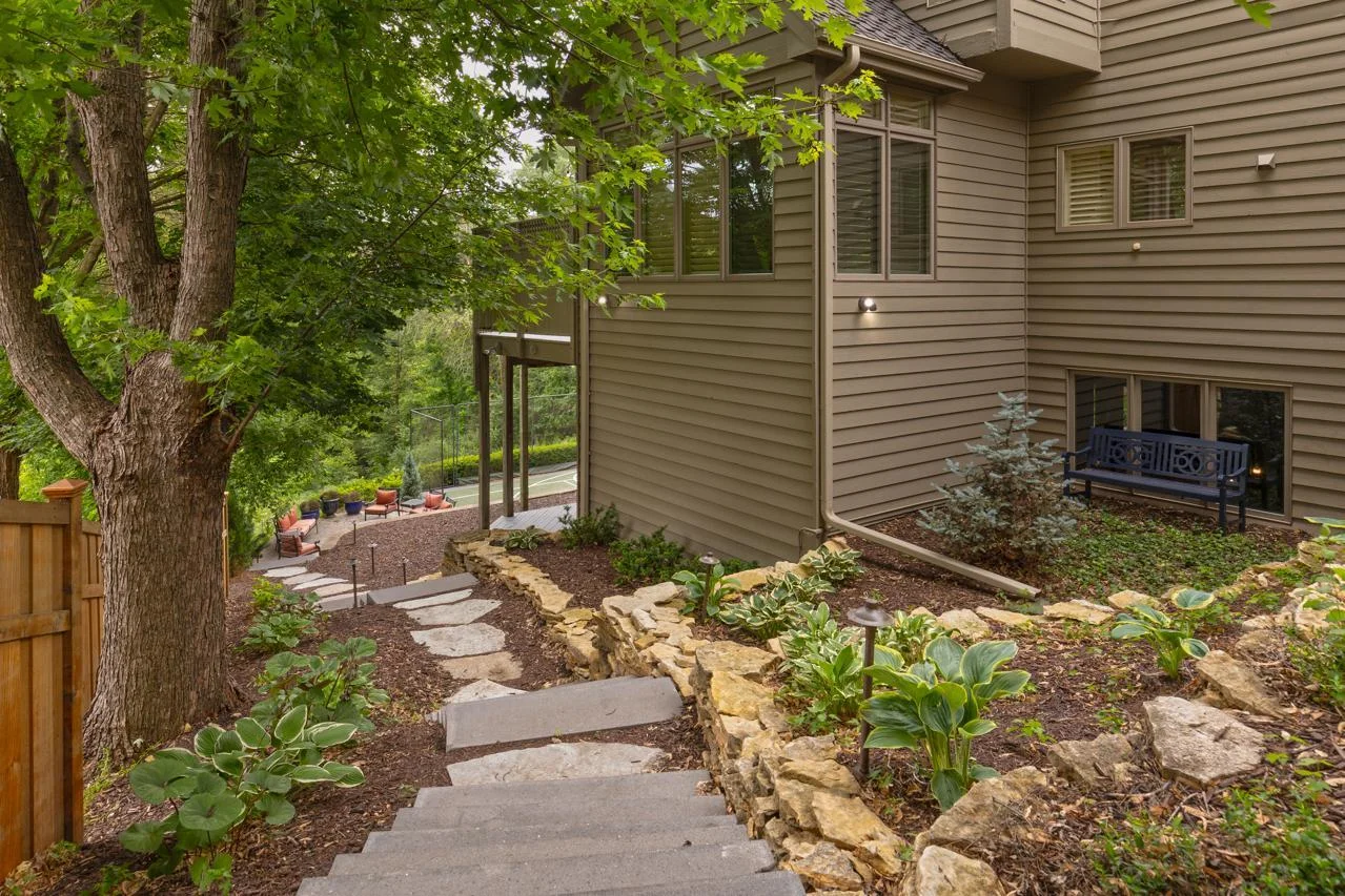Beautifully landscaped yard offering both privacy and tranquility.
