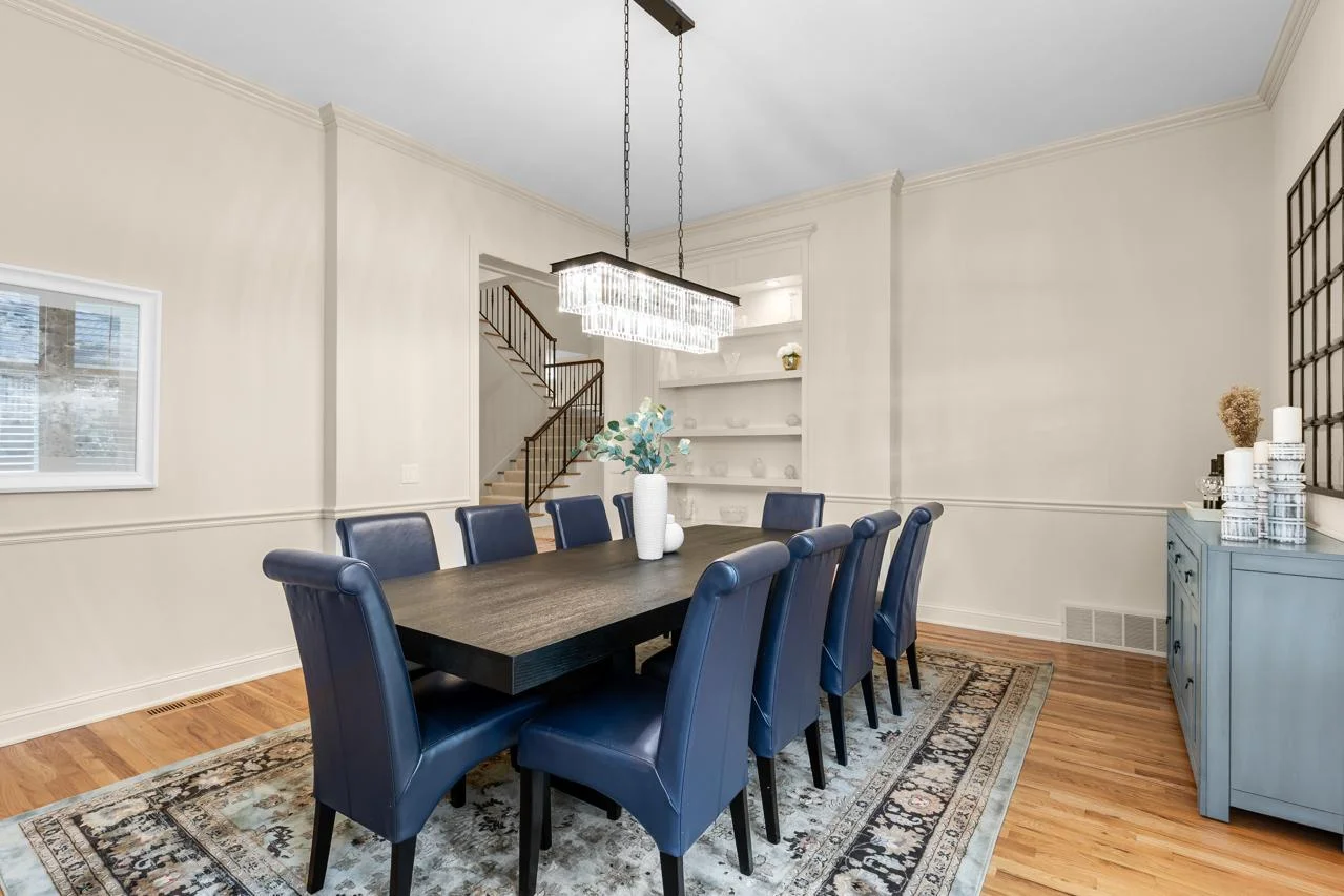the formal dining room also features custom built-in shelving.