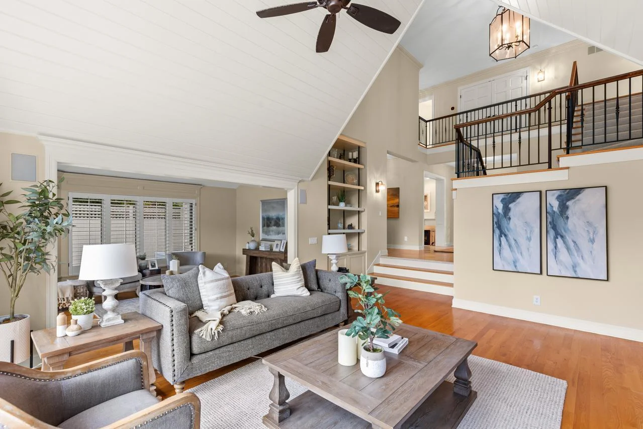 Dramatic vaulted ceilings elevate the living spaces, creating an airy, open feel and enhancing the home's architectural elegance.